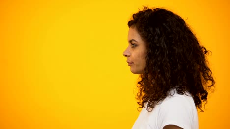 Afro-American-woman-shouting-in-megaphone,-way-to-reliving-stress,-side-view