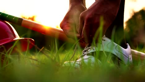 Baseball-players-are-men-tie-their-shoes-before-starting-the-competition-in-the-field