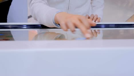 Woman-using-multimedia-touchscreen-display-of-interactive-kiosk