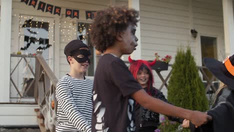 Teenagers-Playing-Games-during-Halloween-Party