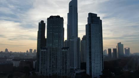 Buenos-Aires-Puerto-Madero-sky-scrappers-and-park-on-sunset-aerial