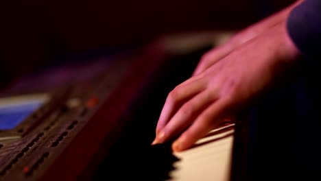 Human-hands-playing-piano-atthe-party.