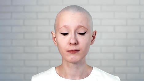 Portrait-of-a-sad,-depressed-woman-suffering-from-cancer-looking-into-the-camera