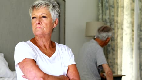 Upset-senior-couple-arguing-with-each-other-in-bedroom