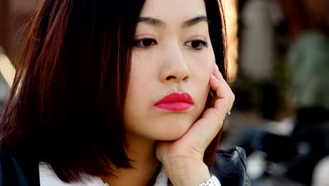 pensive-upset-young-chinese-woman-portrait