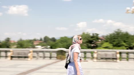 Young-girl-looking-at-Holy-Trinity-Cathedral-of-Tbilisi-Tsminda-Sameba---Georgia