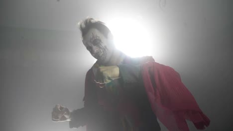 Infernal-evil-halloween-joker-clown-with-a-spooky-costume-laughing-crazy-in-slow-motion