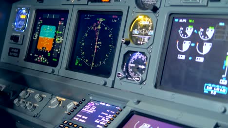 Monitors-on-a-plane's-dashboard,-close-up.