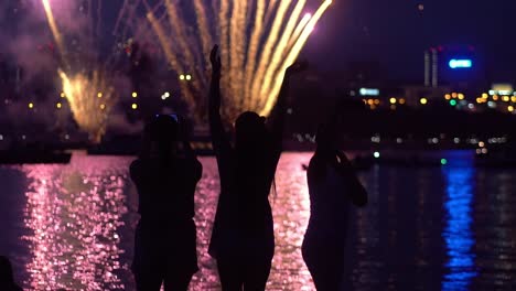 A-group-of-people-are-happy-during-the-fireworks.-slow-motion