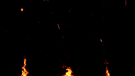 high-speed-shot-of-fire-flames-and-glowing-ash-particles-on-black-background