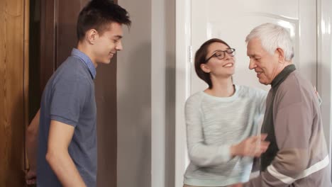 Two-Caregivers-Visiting-Elderly-Man