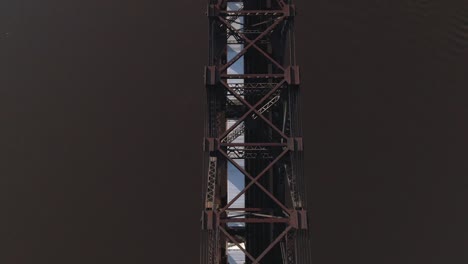 Aerial-View-Looking-Straight-Down-at-Cargo-Train-on-Bridge