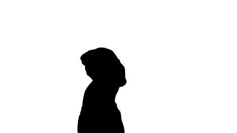 Silhouette-Young-girl-is-making-a-pause-while-doing-yoga.-She-looks-very-peaceful-and-calm,-also-she-feels-happiness-and-smile