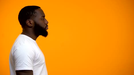 African-American-man-using-megaphone-for-protest,-calling-to-action,-side-view