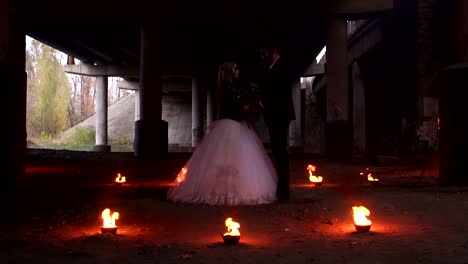 Scary-couple-with-creepy-makeup-on-Halloween-with-fire-and-burning-torches.