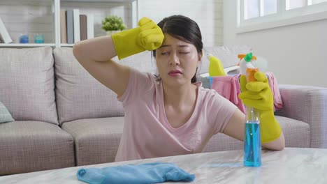 unhappy-asian-korean-housewife-polishing-table