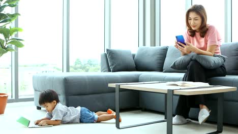 Asian-mother-and-son-in-living-room.