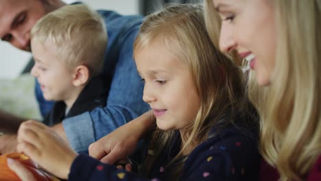 Parents-and-children-carving-pumpkins