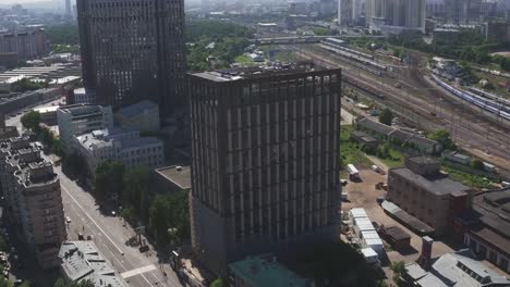 Aerial-view-of-Just-finished-modern-large-apartment-building.-Development-infrastructure-city-for-big-population,-modern-skyscrapers-and-tall-edifices-of-megapolis,-urban-transportation-system.