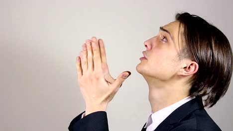 Young-man-praying,-asking-God-for-help.