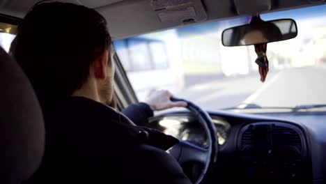 Sad-serious-man-driving-car