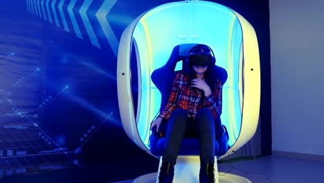 Young-girl-sitting-in-virtual-reality-attraction-and-feeling-scary