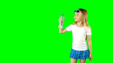 Young-caucasian-girl-is-holding-in-outstretched-hand-bottled-still-water.-Girl-speaking-and-laughing.-Clip-contains-solid-green-instead-alpha-channel.