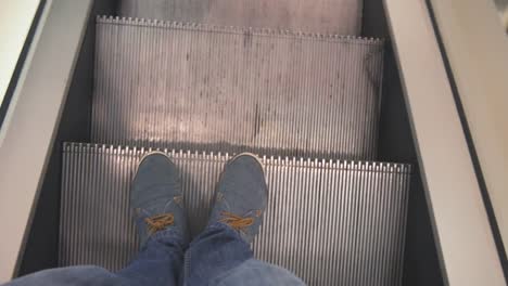 a-man-descends-on-an-escalator