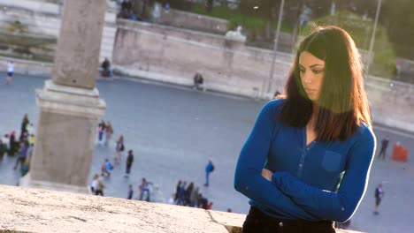 Close-up-on-thoughtful-sad--Asian-woman-in-city-at-sunset