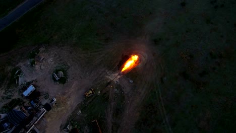 Aerial-shooting-Flaring-of-high-pressure-gas-from-the-gas-well-at-sunset.