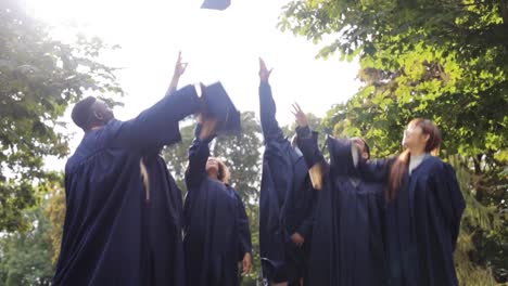 happy-students-throwing-mortar-boards-up