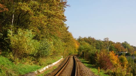 The-transition-between-the-railroad-line-from-the-right-to-the-left-during-the-sunny-autumn-day-in-slow-motion.