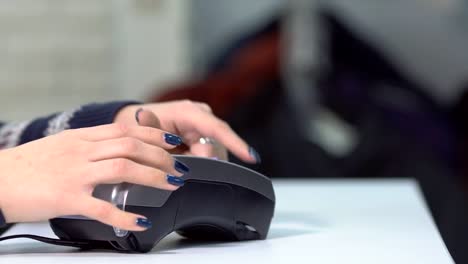 close-up-of-hand-inserting-bank-card-to-terminal