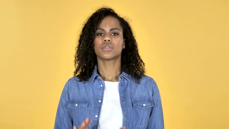 African-Girl-Confused-and-Scared-of-Problems-Isolated-on-Yellow-Background