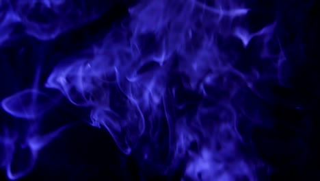 Blue-Steam-Rises-from-up.-Blue-smoke-over-a-black-background.-Smoke-slowly-floating-through-space-against-black-background.-Slow-Motion.