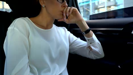 Nervous-lady-boss-annoyed-with-phone-call,-throwing-gadget-out-of-car-window