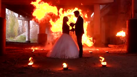 Beautiful-couple-in-wedding-attire-with-a-terrible-makeup-for-Halloween.Hellfire