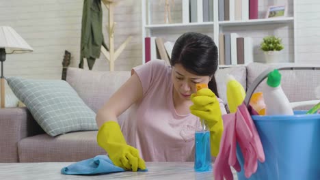 housewife-trying-hard-remove-dust-on-table