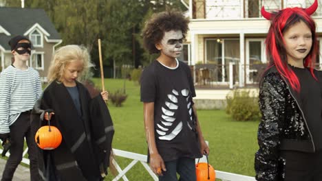 Four-Children-in-Costumes-on-Halloween-Party