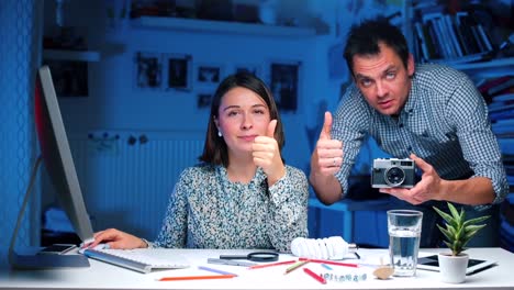 The-guy-and-the-girl-are-discussing-the-camera,-showing-like