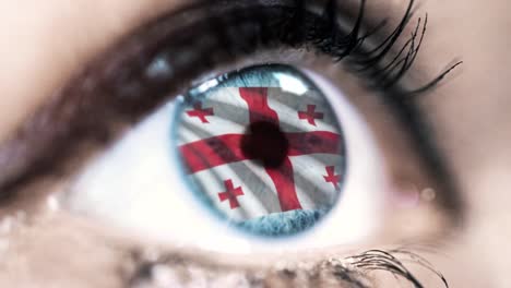 woman-blue-eye-in-close-up-with-the-flag-of-Georgia-in-iris-with-wind-motion.-video-concept