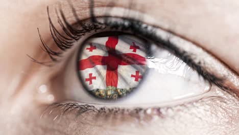 woman-green-eye-in-close-up-with-the-flag-of-Georgia-in-iris-with-wind-motion.-video-concept