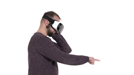 Man-imitates-retro-phone-using-while-wearing-VR-glasses.-Digital-age-and-new-technologies
