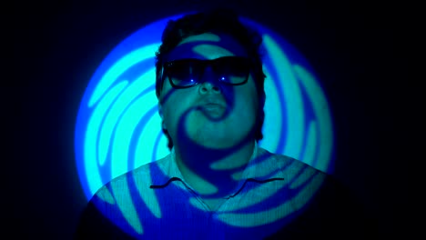 Portrait-of-a-fat-man-in-a-multicolored-light-beam.