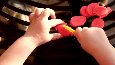 baby-hands-cutting-plasticine---fine-motor-skill-develop-dexterity---pov-above-view