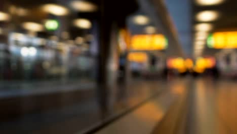 People-hurrying-to-plane,-walking-on-elevator,-passing-by-terminals-in-airport