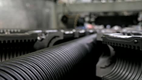 Manufacture-of-plastic-water-pipes.-Manufacturing-of-tubes-to-the-factory.-The-process-of-making-plastic-pipes-on-the-machine-tool-with-the-use-of-water-and-air-pressure.-Special-corrugated-forms.