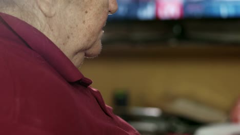 Elderly-woman-sleeping-in-front-of-TV.