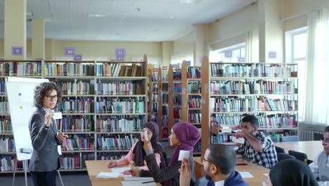 Group-of-Middle-Eastern-Students-Studying-English-at-College