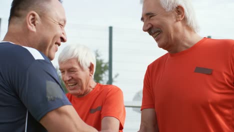 Elderly-Football-Players-Shaking-Hands